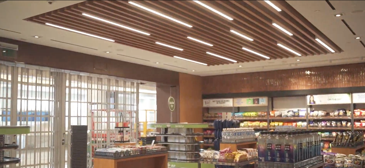 Commercial interior with decorative linear wood-look ceiling baffles