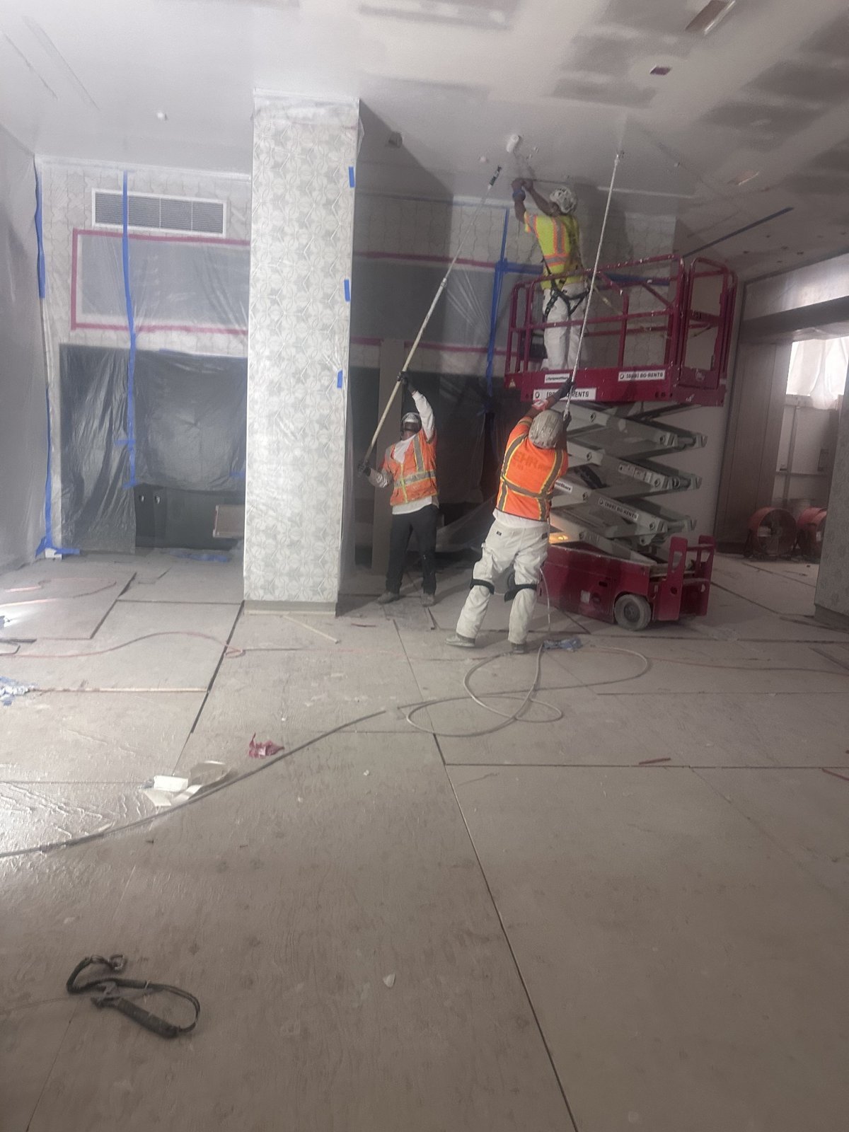 PDG crew applying finishing work to a commercial interior ceiling
